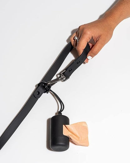 Wild One Dog Poop Bag Holder and Dispenser with Leash Attachment, Leak Proof, Easy Twist Top for Refills, Includes 1 Box Poop Bags, Black